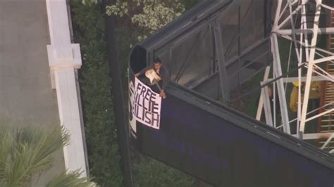 Man climbs California radio tower holding 'Free Billie Eilish' sign